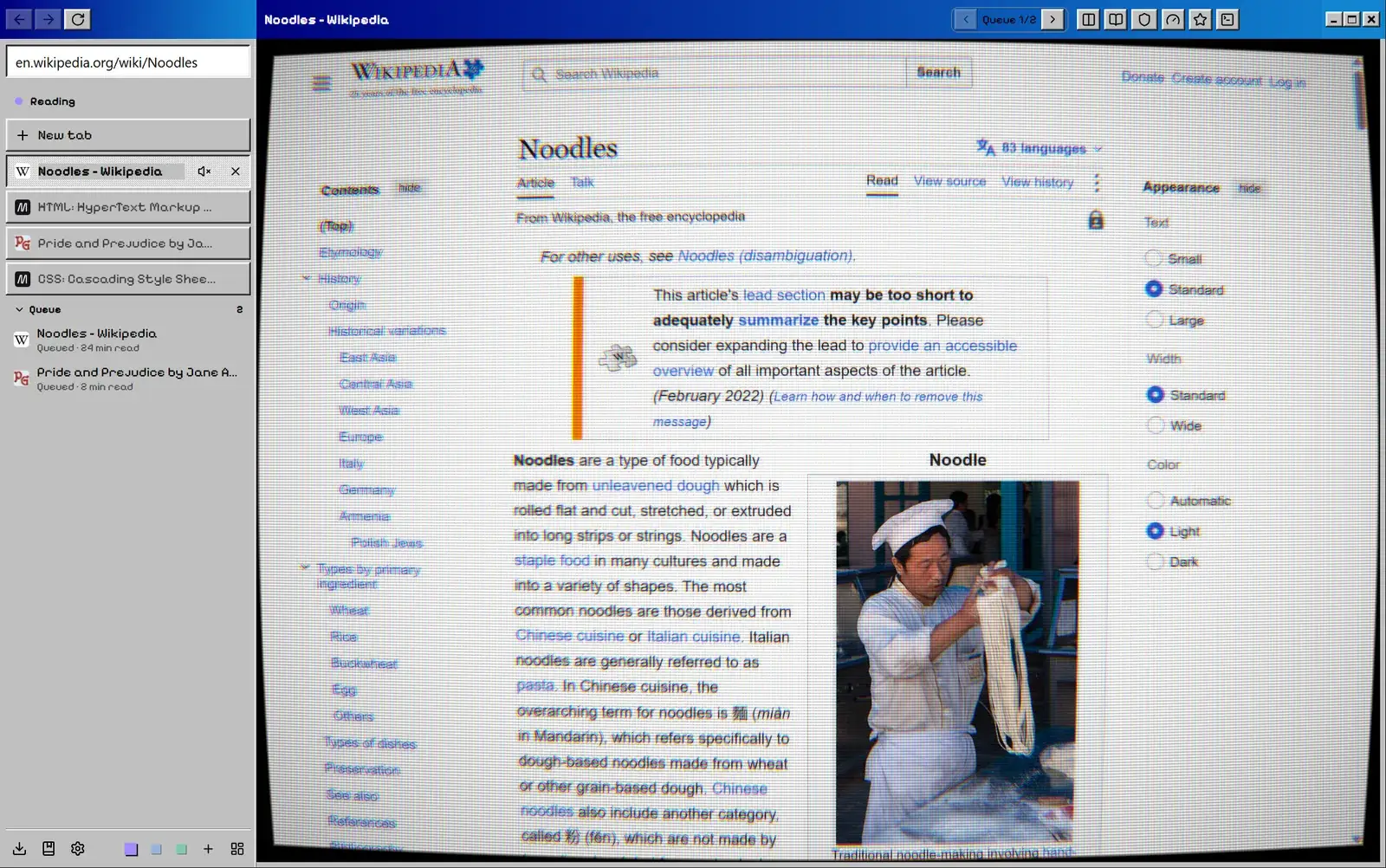 Classic 98 with the CRT screen on, showing curvature and scanlines over a Wikipedia page